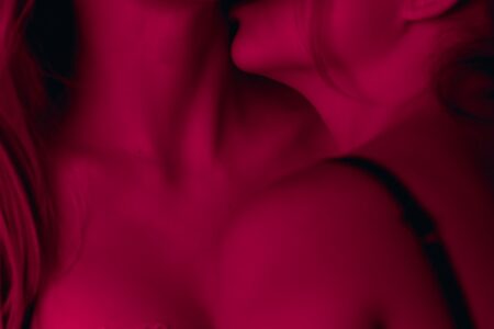 two woman wearing brassieres
